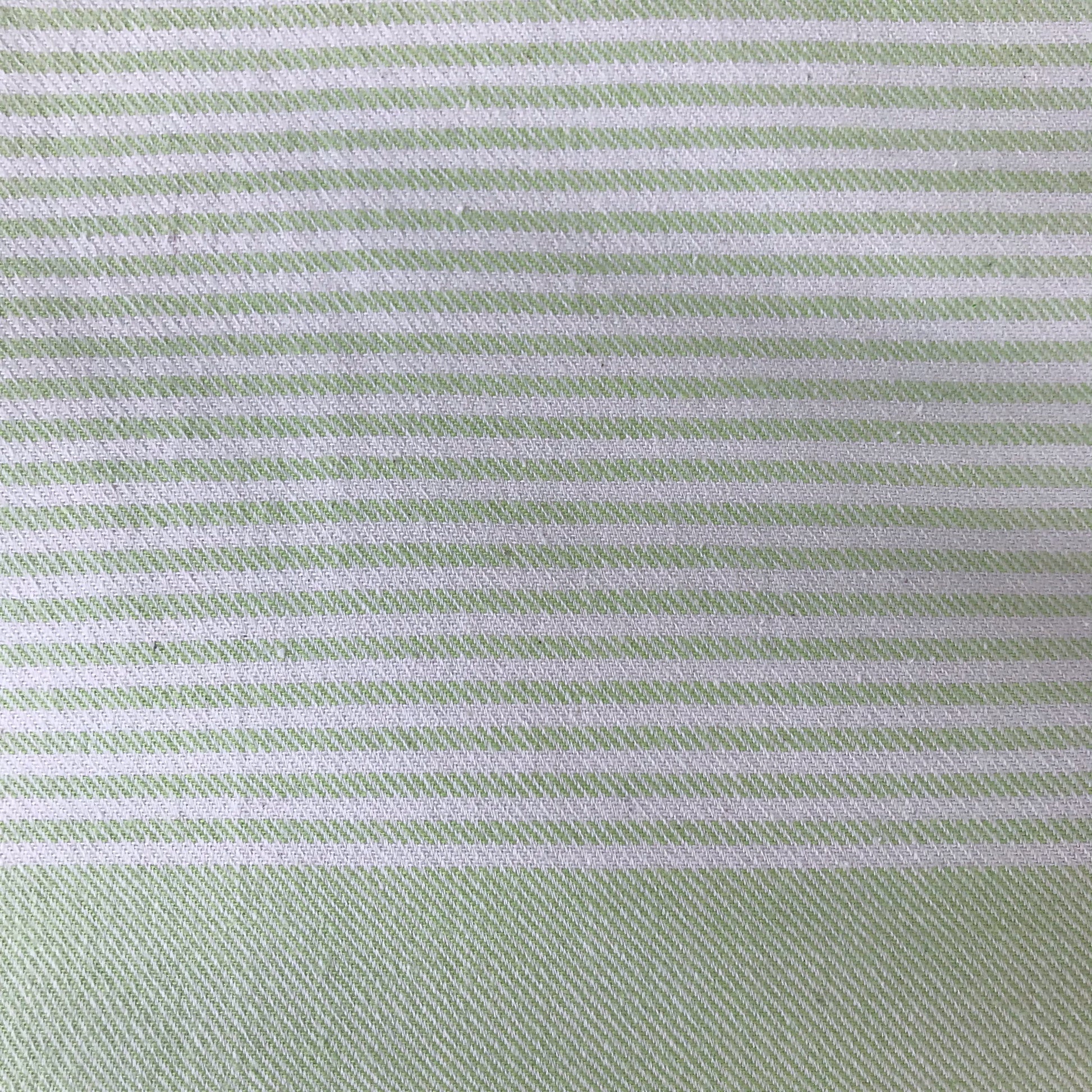 Breeze is an ethically made green striped turkish towel with pocket