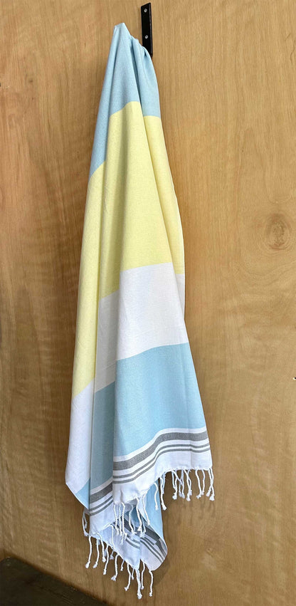 Agatti Pocketowel folded - this is a large beach towel with pocket that folds up small, hung