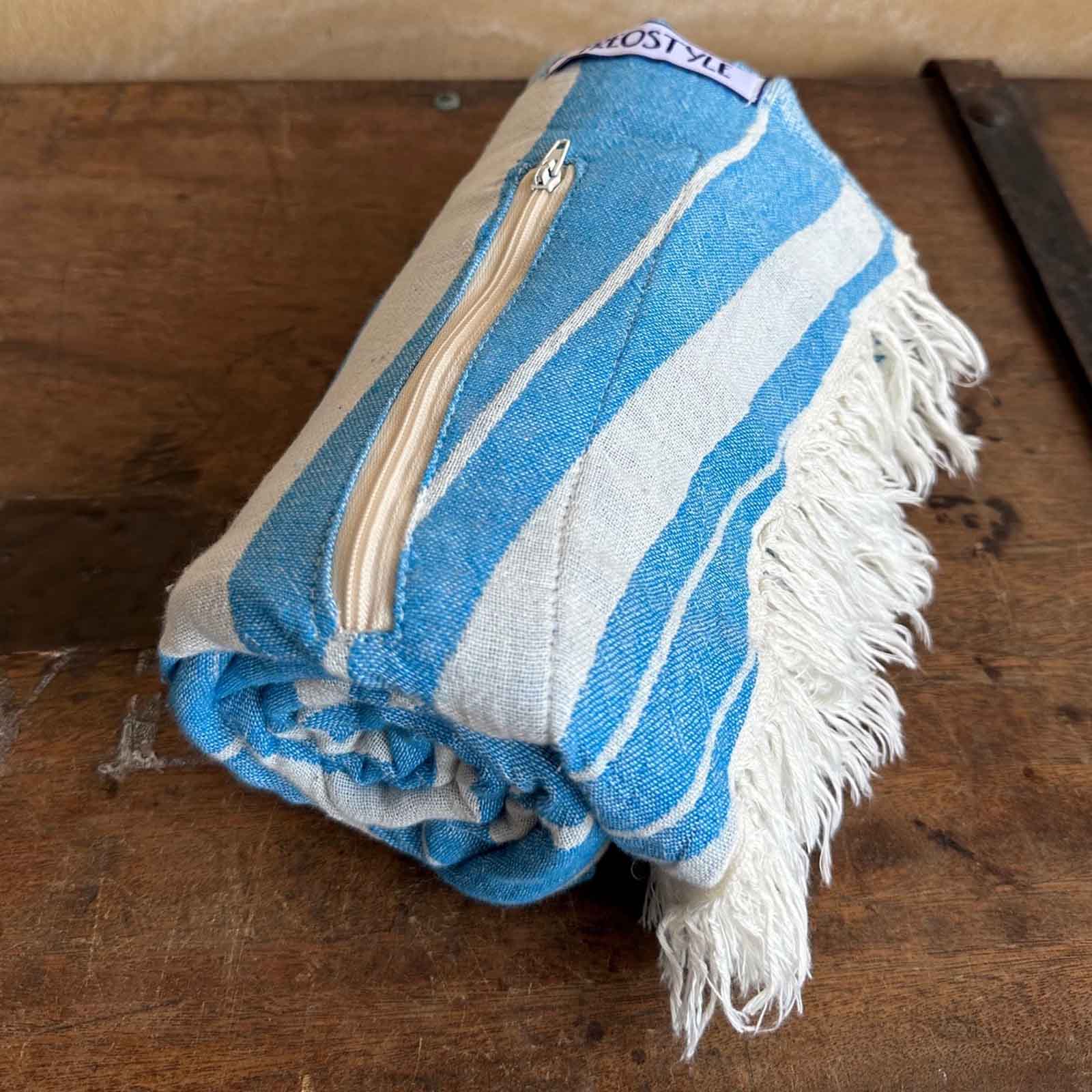 Ocean Haze Turkish Towel with Pockets, rolled, by Freostyle