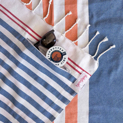 Simpson Beach Pocketowel, large beach towel with pocket, by Freostyle close up of pocket, orange, blue and white stripes