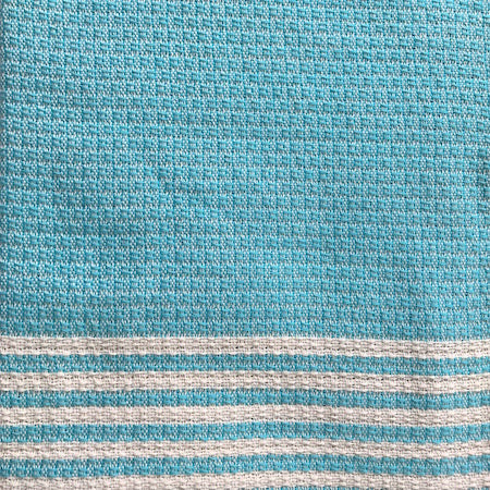 Azure authentic Turkish Towel features a pale turquoise and cream traditional weave across the main body of the towel, with alternating thin turquoise and cream stripes at each end