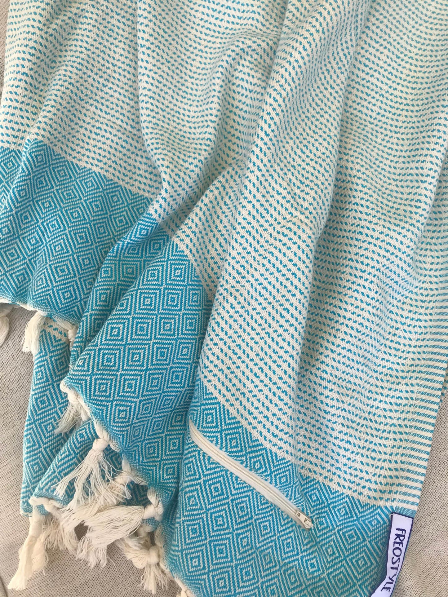Freostyle Turkish Beach Towel with Pockets, Capri, Aqua Blue, displayed
