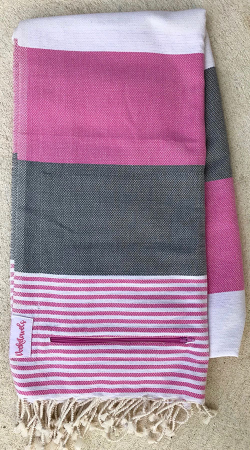 Pondicherry Pocketowel rocks Pink, Grey and White stripes for a retro coastal vibe. Pocketowels are large beach towels with pockets