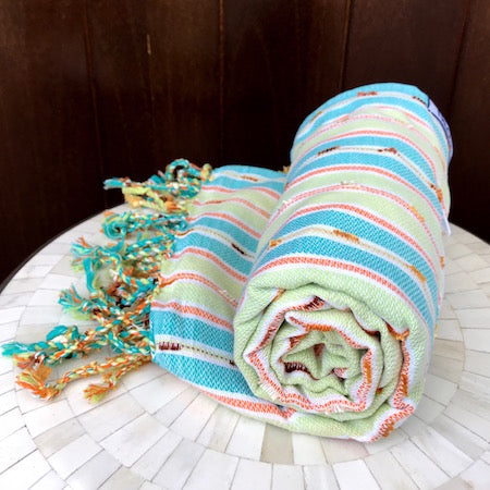The light-weight Rockpool turkish towel rolls up small