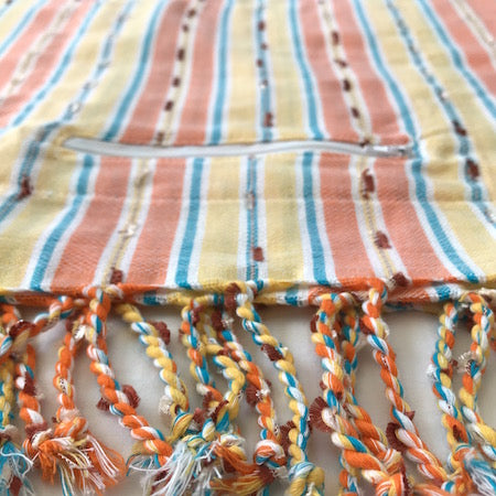 Sunset Stripe: stunning turkish towel with handy pocket, in orange, yellow and blue woven stripes